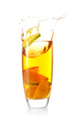 Glass of tasty cold ice tea with splash on white background