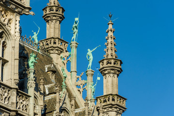 Statues on the roof of the Gothic Revival style Maison du Roi / Broodhuis building the Brabantine Gothic style facades on Grand Place in Brussels Belgium