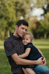 Happy dad and child spending time outdoors. Father daughter moments.