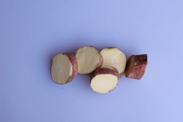 Fresh sweet potatoes isolated on white background