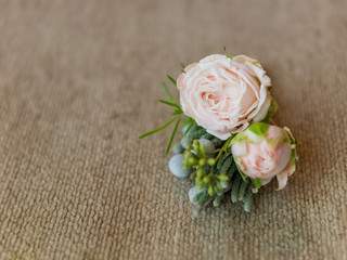 Boutonniere of fresh flowers. Selective focus.