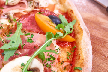 Pizza on wood with vegetables. Prepared, delivery