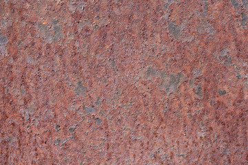 Oxidized metal surface, rust on iron surface, abstract rusty metal panel texture background.