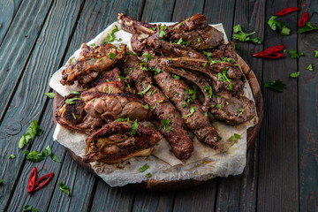 Assorted grilled meats: beef, pork, poultry, lamb. Juicy slices of meat delicacies. Food for a big company, a picnic.