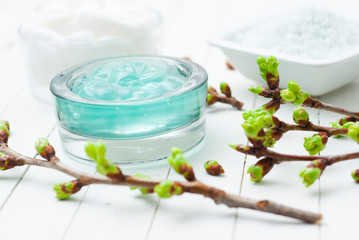 Beauty products and fresh leaf buds