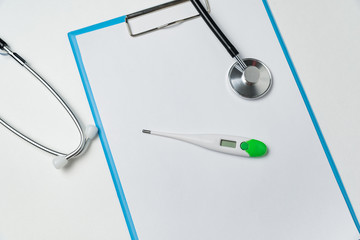 Stethoscope, thermometer and blank sheets of paper on white background. Prescription, treatment concept