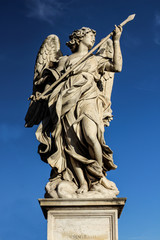 Obraz premium Angel statue on Ponte Sant'Angelo (Bridge of angels) in Rome - Febraury 2019