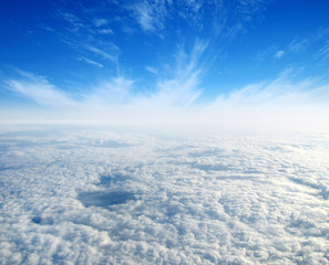 Naklejka premium White clouds. View from the window of an airplane