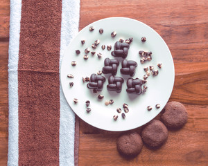 The Chocolate on a plate. Delicious plate of Chocolate with Chocolate filled cookies.