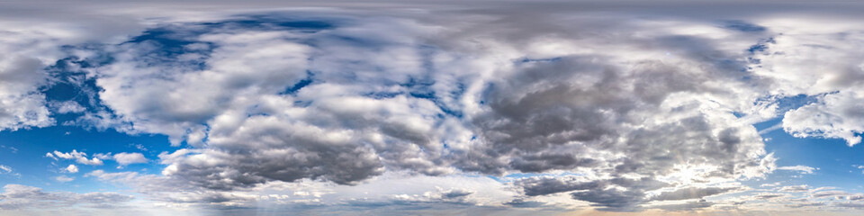 Seamless hdri panorama 360 degrees angle view blue sky with beautiful evening fluffy cumulus clouds without ground with zenith for use in 3d graphics or game development as sky dome or edit drone shot