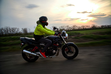 Fototapeta na wymiar man rides a motorcycle on a highway
