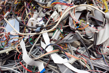 A pile of discarded computer wiring and components waiting for WEEE recycling