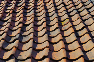 Closeup of an old tiled roof.
