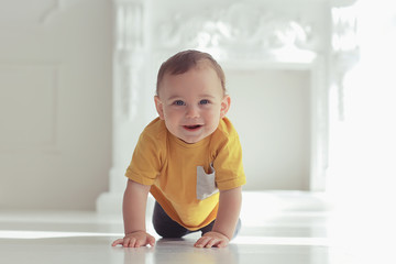 toddler child in a bright studio / little boy infant beautiful healthy child