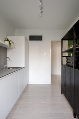 White kitchen with dark sideboard