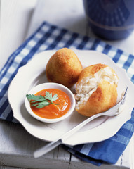 Beautiful tasty of a Potato Croquette balls with tomato sauce on a plate