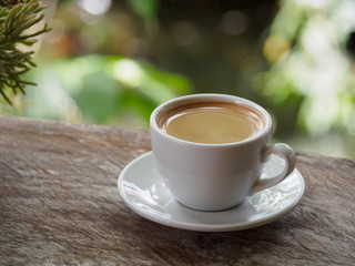 Hot coffee americano on the old wooden table