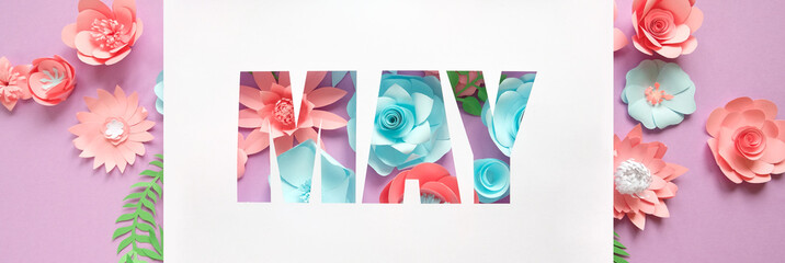 The lettering may, made of paper flowers. Hello, may. Concept of flowering, spring