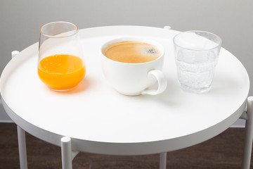 coffee, orange juice and water for breakfast
