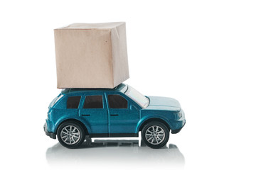 Concept of a transport delivery service. Car with a box on the roof, isolated on a white background.