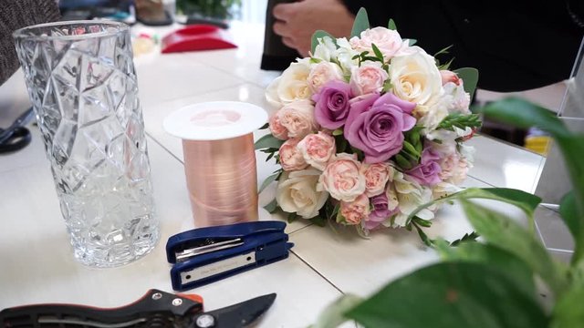 a bouquet of flowers on the table at the florist