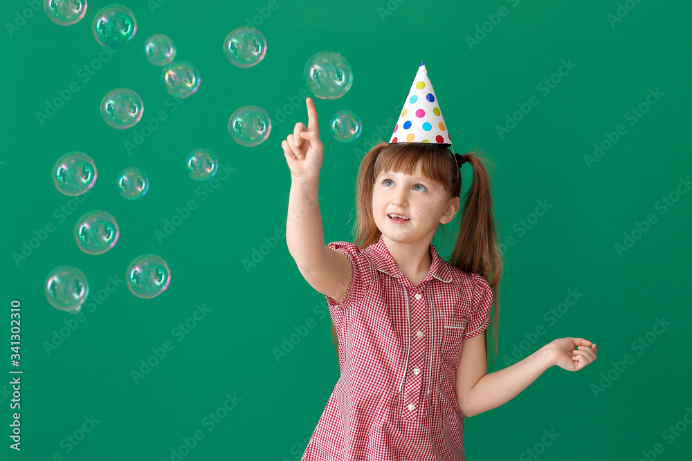 Poster Little girl celebrating Birthday on color background