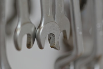 Shiny spanners in a row in the working place of a mechanic.