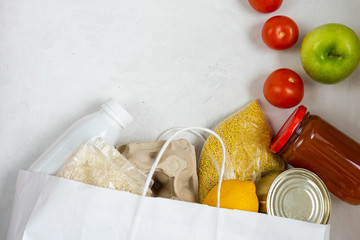 A dry ration package to help people in need in quarantine. Cereals, eggs, vegetables and fruits