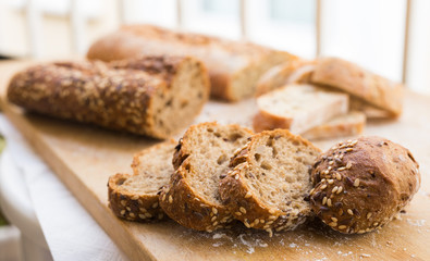 fresh loaf of bread on wooden board