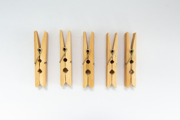 clothespins made of wood on a white background