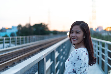 Fototapeta premium Vietnamese girl standing on an old bridge