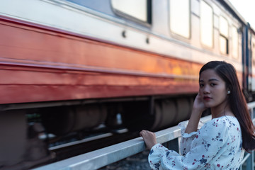 Vietnamese girl standing on an old bridge