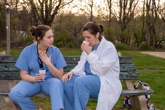 Two Sad Nurses Taking A Break Outside