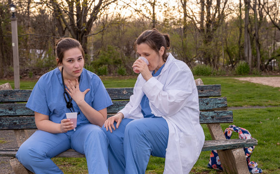 Two Sad Nurses Taking A Break Outside