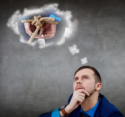 Businessman looks on tide up himself in white cloud over head.