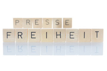 Freedom of the press important for democracy. "Pressefreiheit" as an isolated word on a white background. Germany