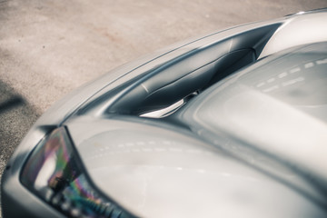 Obraz premium Front bumper and lights of a silver car