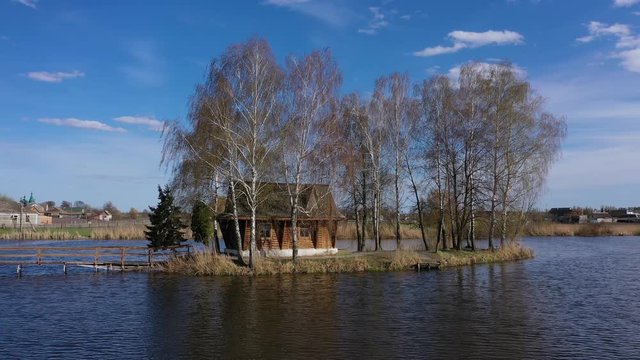 Rural landscape of old abandoned house in the middle of the lake. Autumn morning landscape. Village of Old Solotvin, Zhytomyr Region, Ukraine.