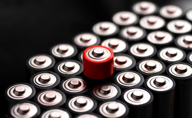 A closeup of the positive ends of battery cells.