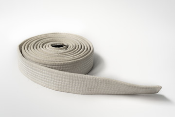 Zen art. White belt martial arts on white background. Clothes for martial arts, aikido, karate,...