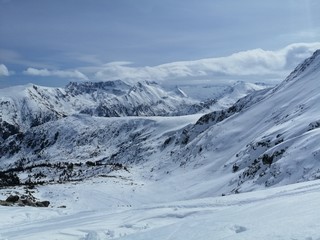 Areal view over snowy mountain range.  Location: Bansko, Bulgaria.