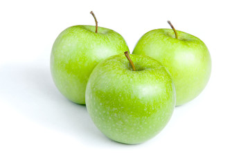 Three ripe green apples on a white background. isolated