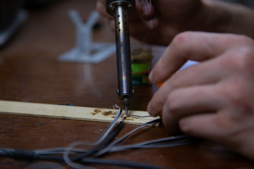 Fototapeta na wymiar blowtorch, male hands, equipment repair at home