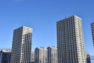 Fototapeta na wymiar Facade of a new modern high-rise residential buildings.