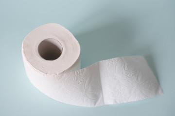 white toilet paper on a blue background