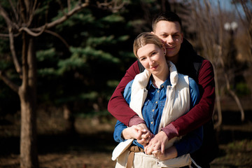 Beautiful young couple in love walks in the park.