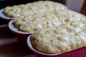 The Confectioner Prepares The Dough, Bread, Cakes. Preparation Easter Cake. Dough fermentation. The dough with raisins and candied fruit