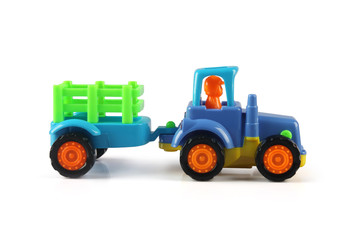 Toy Tractor model with the trailer on a white background