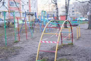 Closed playground with quarantine warning tape