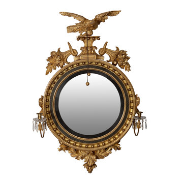 A fine early 19th-century antique giltwood convex mirror with a carved wooden eagle and crystal drop candle arms, England, circa 1810